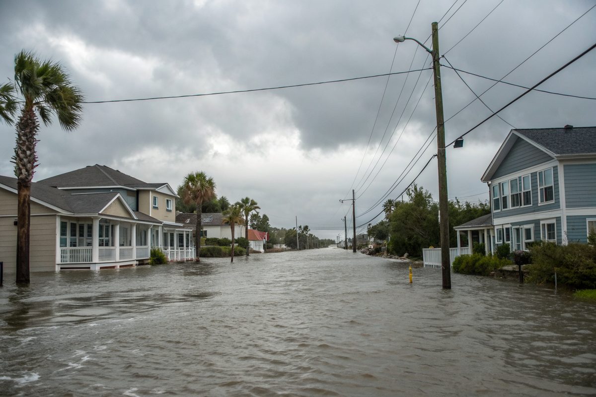 Floodwater covering a residential street after a hurricane